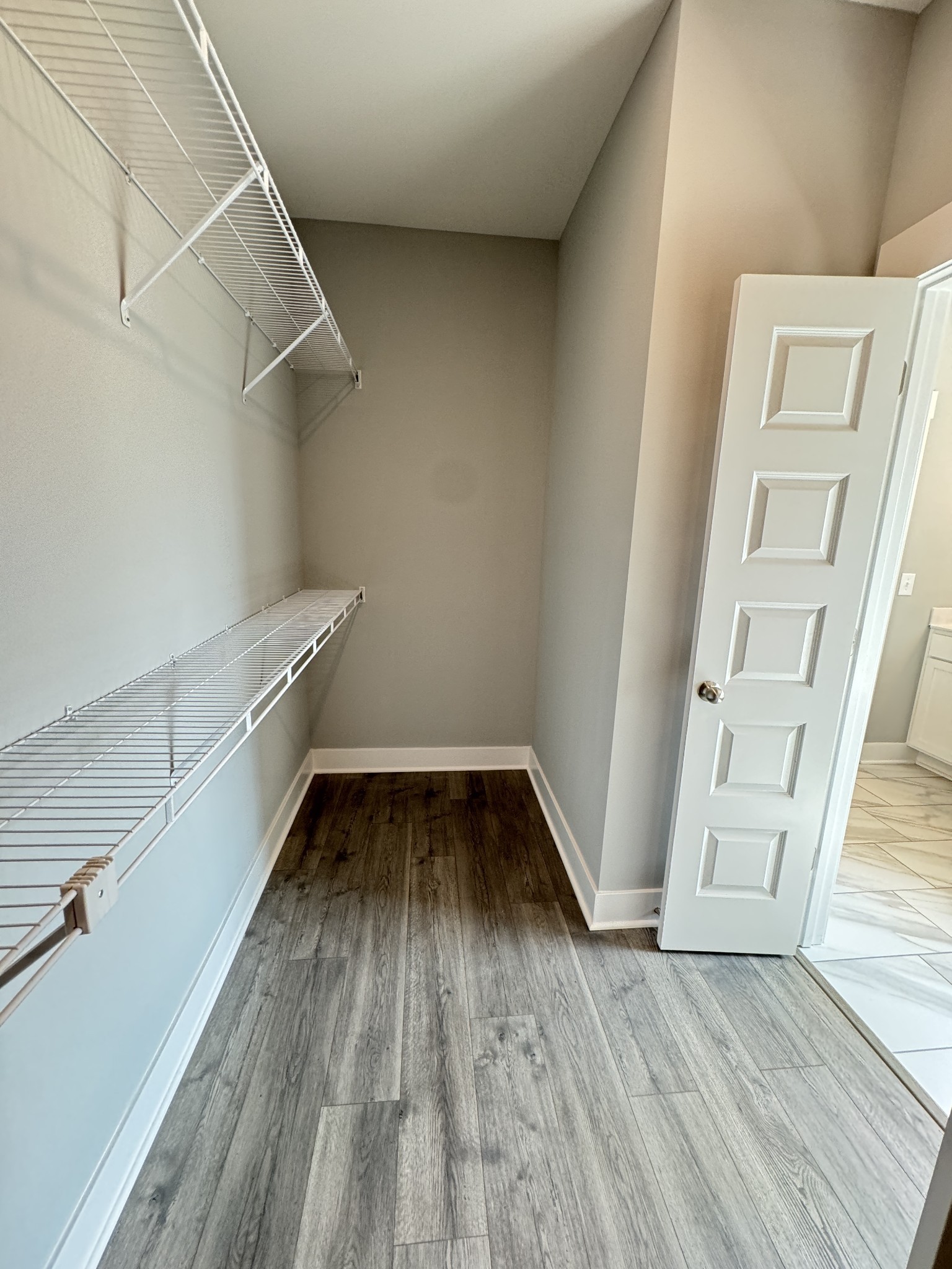 5482 Rooker Road Smyrna, TN 37167 - Photo 19 of 30 a view of a room with wooden floors and white walls