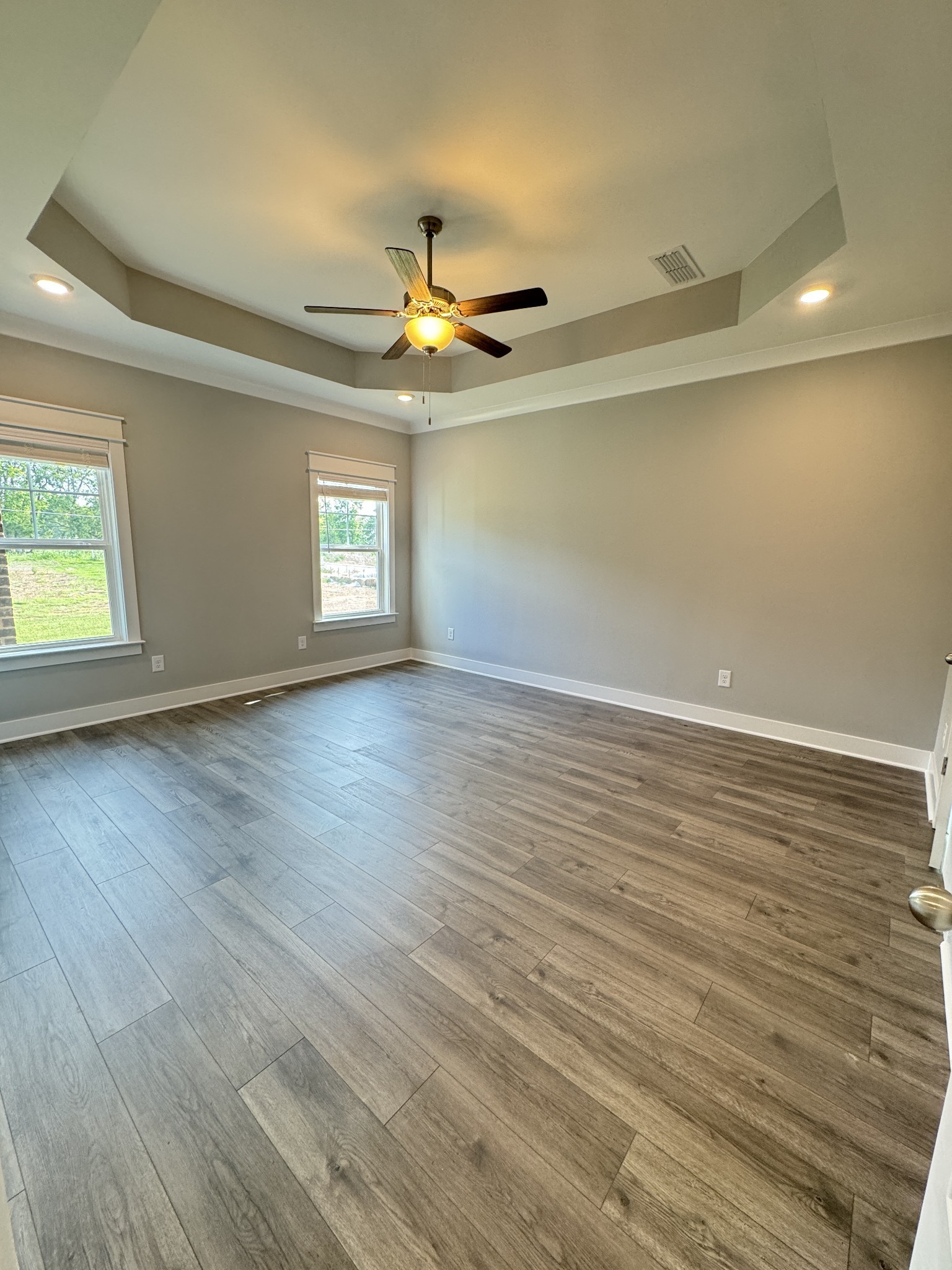 5482 Rooker Road Smyrna, TN 37167 - Photo 25 of 30 an empty room with wooden floor and windows