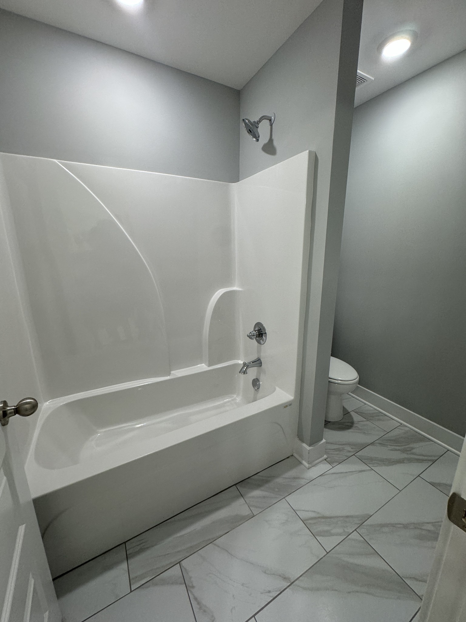 5482 Rooker Road Smyrna, TN 37167 - Photo 26 of 30 a bathroom with a bathtub and a toilet