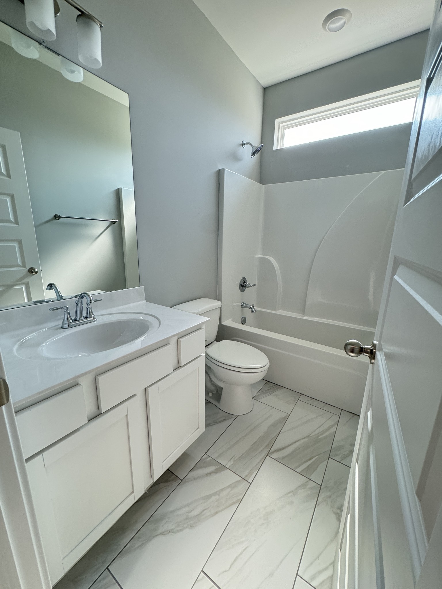 5482 Rooker Road Smyrna, TN 37167 - Photo 6 of 30 a bathroom with a double vanity sink toilet and shower