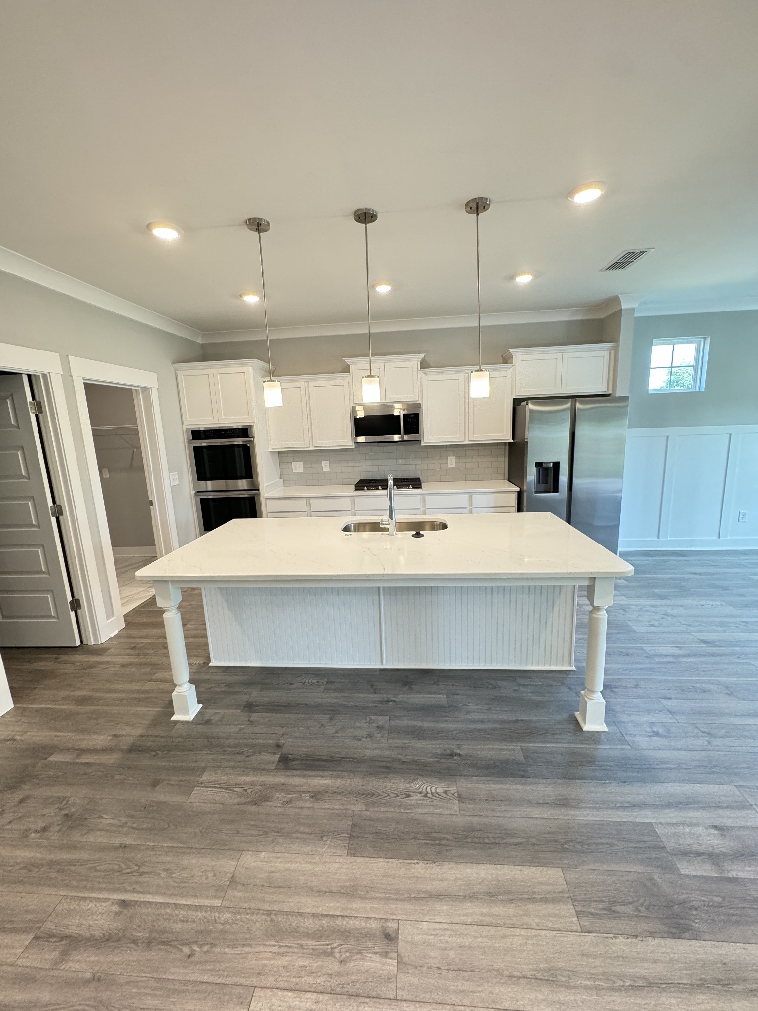 5482 Rooker Road Smyrna, TN 37167 - Photo 10 of 30 a large white kitchen with kitchen island white cabinets and refrigerator