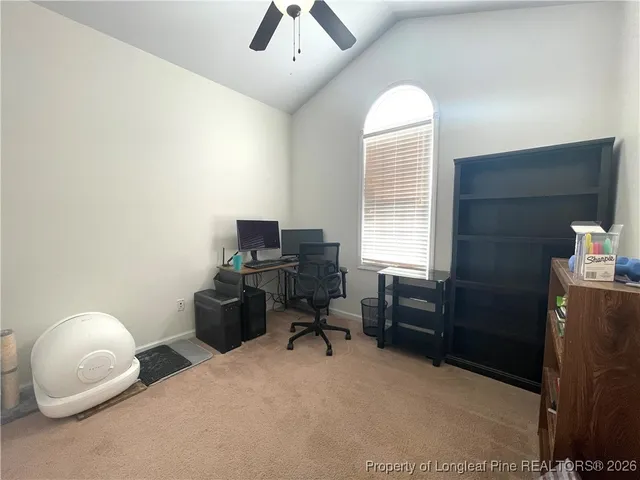 a workspace with furniture and a window