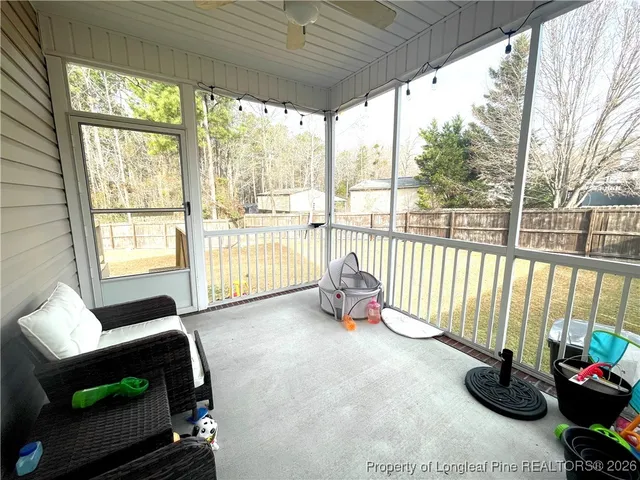 a room with furniture and a large window