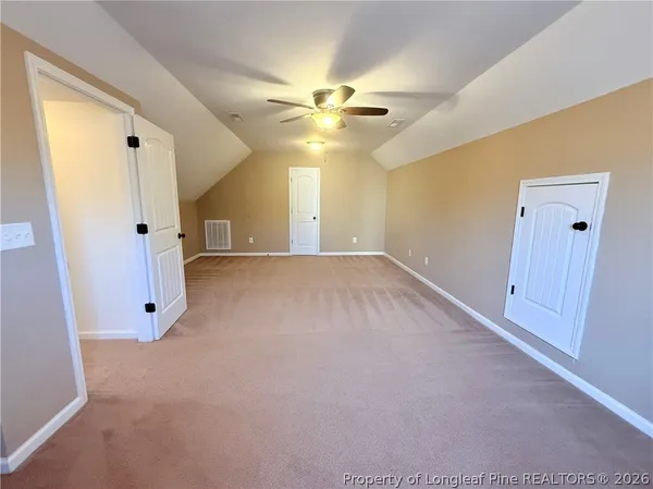 a view of balcony with wooden floor and fence