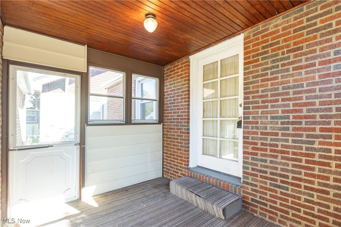 6168 Manchester Road Parma, OH 44129 - Photo 21 of 25 Carpeted breezeway connecting the back door to the garage