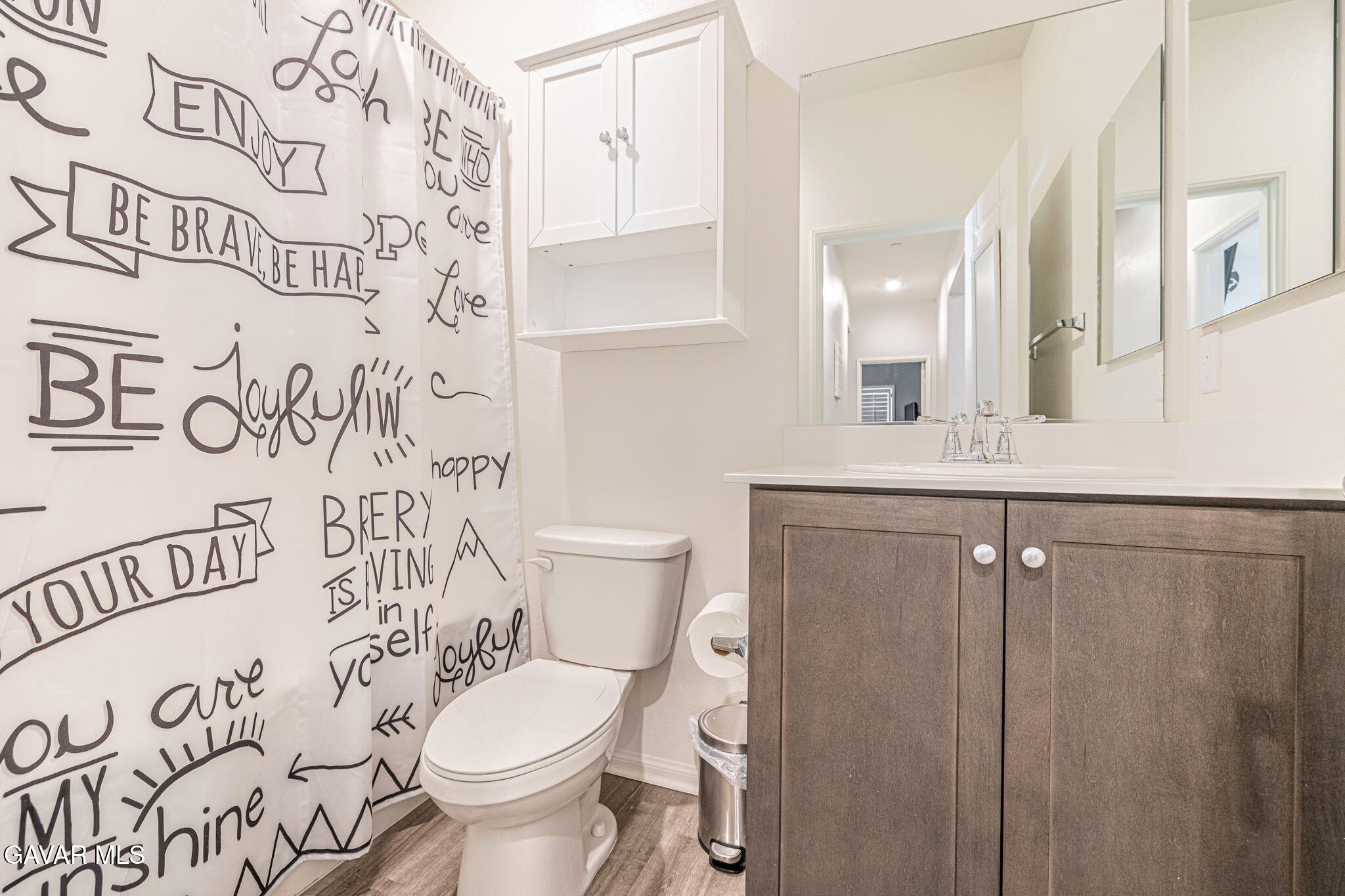 44302 Marbella Street Lancaster, CA 93536 - Photo 2 of 38 a bathroom with a toilet sink and mirror