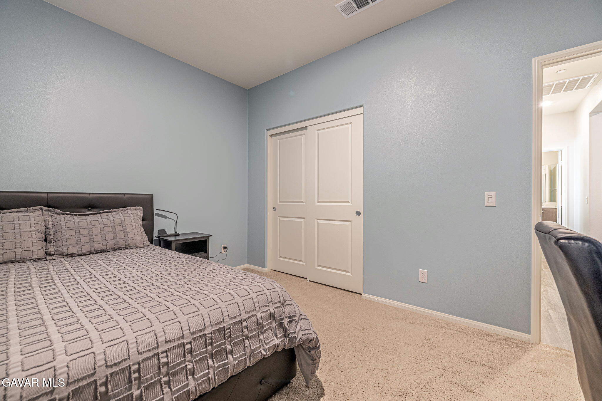 44302 Marbella Street Lancaster, CA 93536 - Photo 22 of 38 a bedroom with a bed and a cabinets