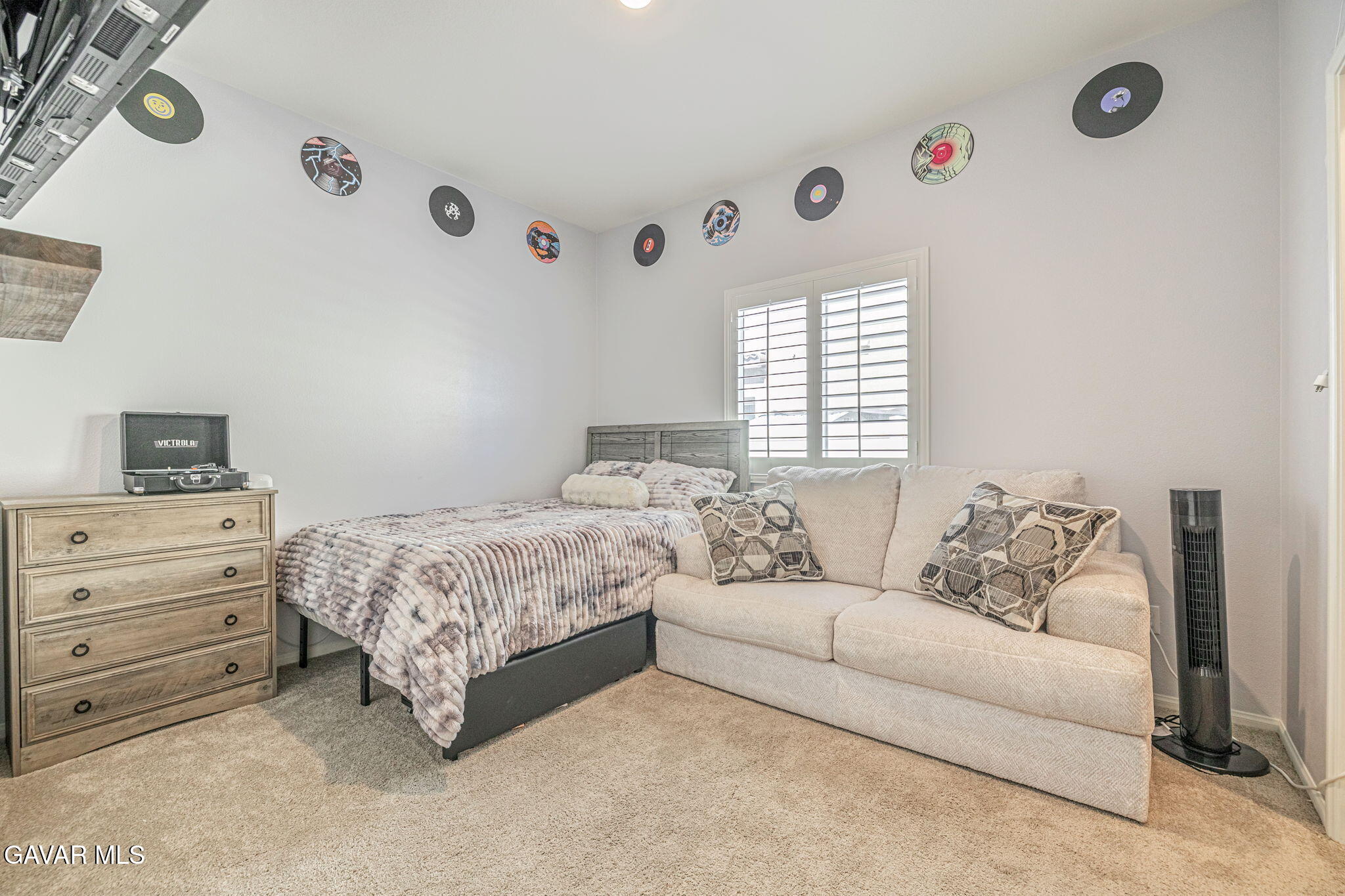 44302 Marbella Street Lancaster, CA 93536 - Photo 23 of 38 a bedroom with a bed and a window