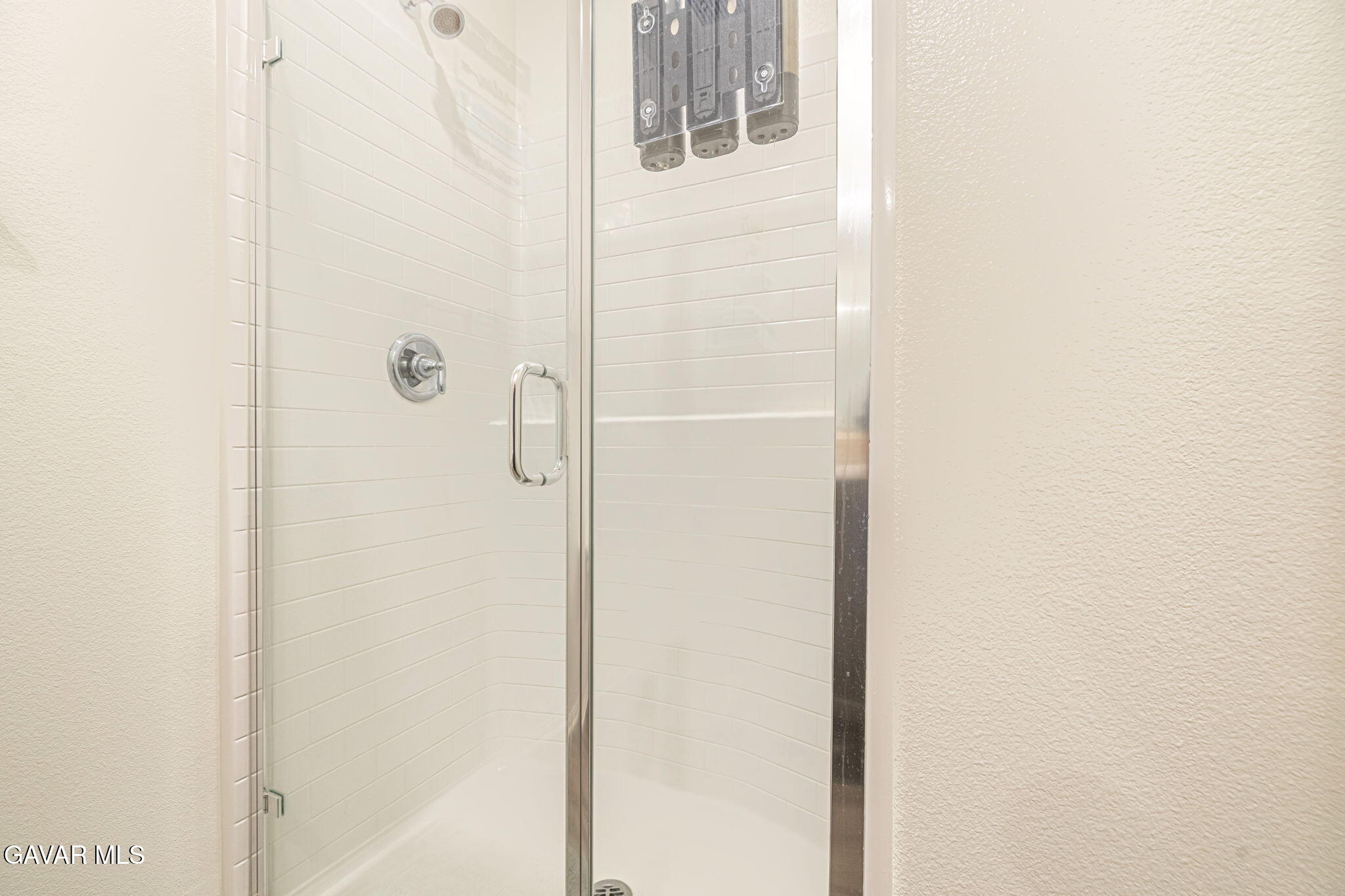 44302 Marbella Street Lancaster, CA 93536 - Photo 28 of 38 a bathroom with a shower