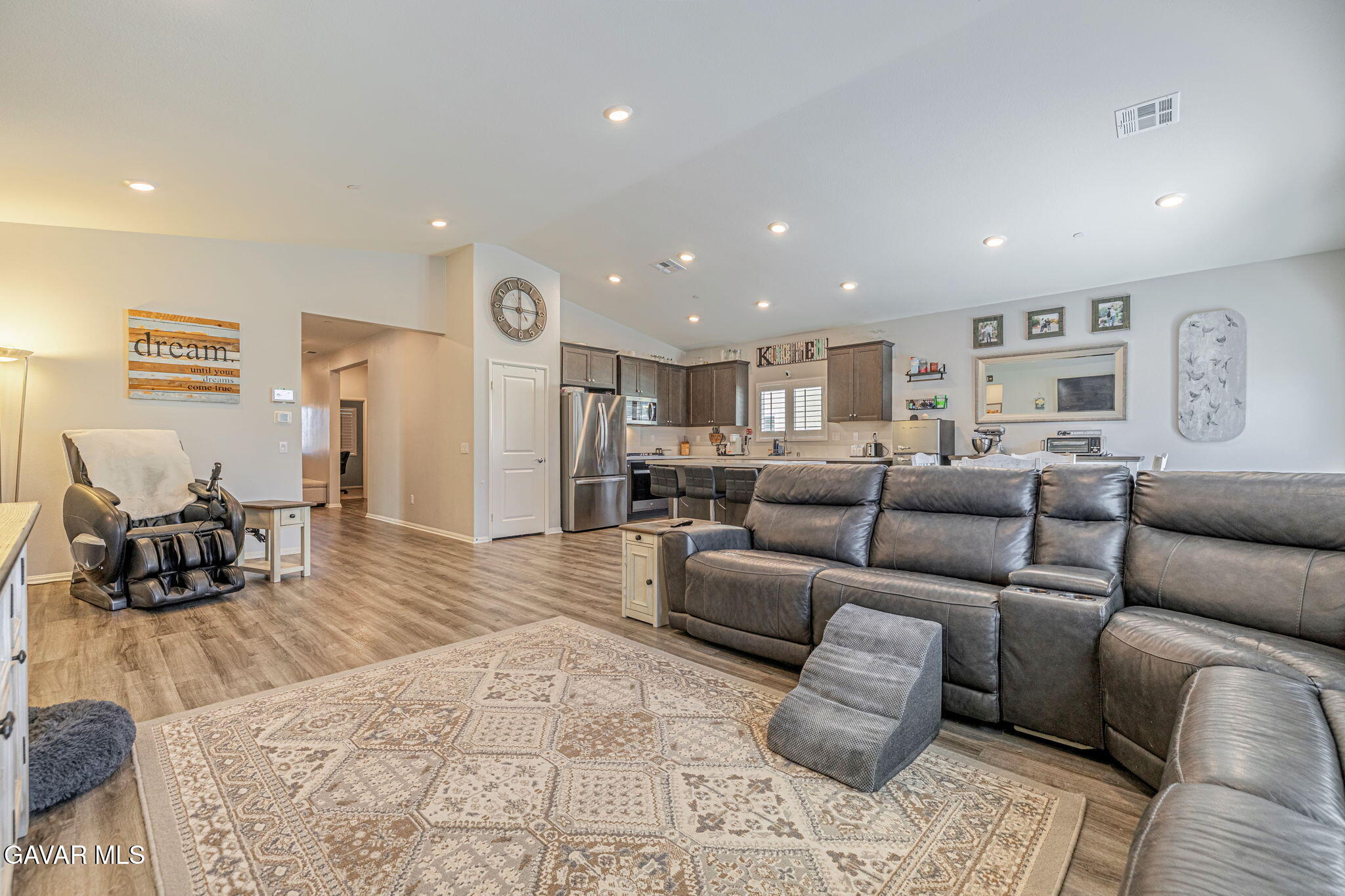 44302 Marbella Street Lancaster, CA 93536 - Photo 30 of 38 a living room with furniture and a wooden floor