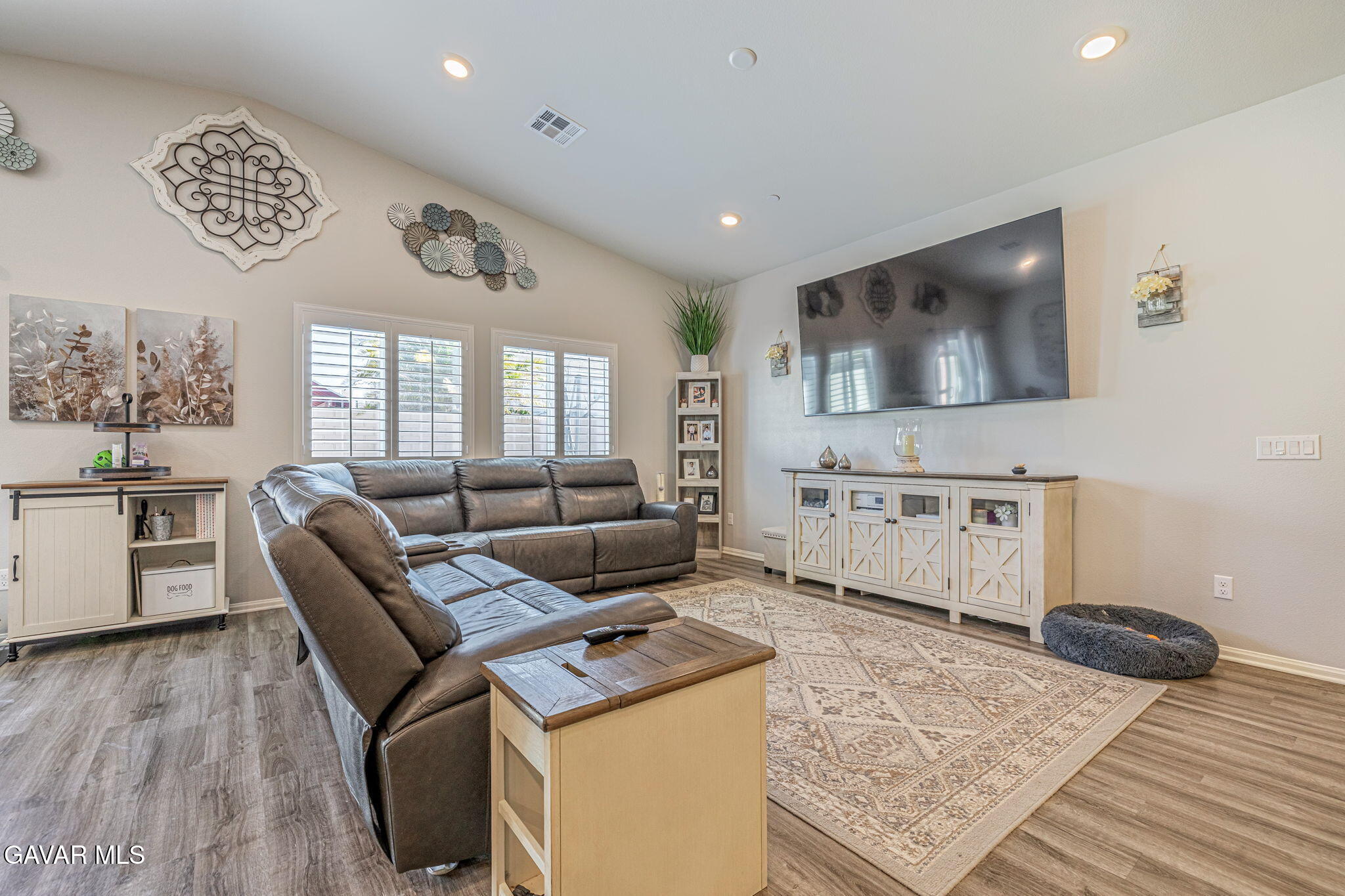 44302 Marbella Street Lancaster, CA 93536 - Photo 31 of 38 a living room with furniture and a flat screen tv