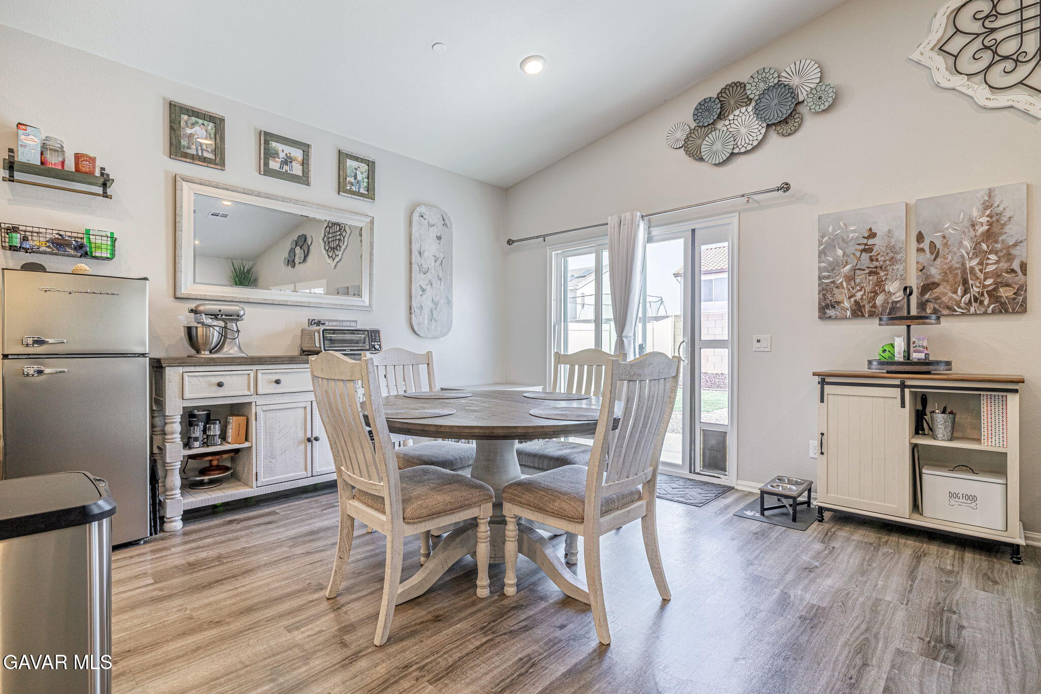 44302 Marbella Street Lancaster, CA 93536 - Photo 32 of 38 a view of a dining room with furniture and wooden floor