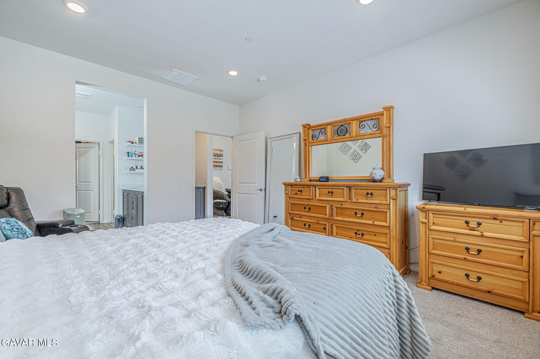 44302 Marbella Street Lancaster, CA 93536 - Photo 36 of 38 a bedroom with a bed and dresser