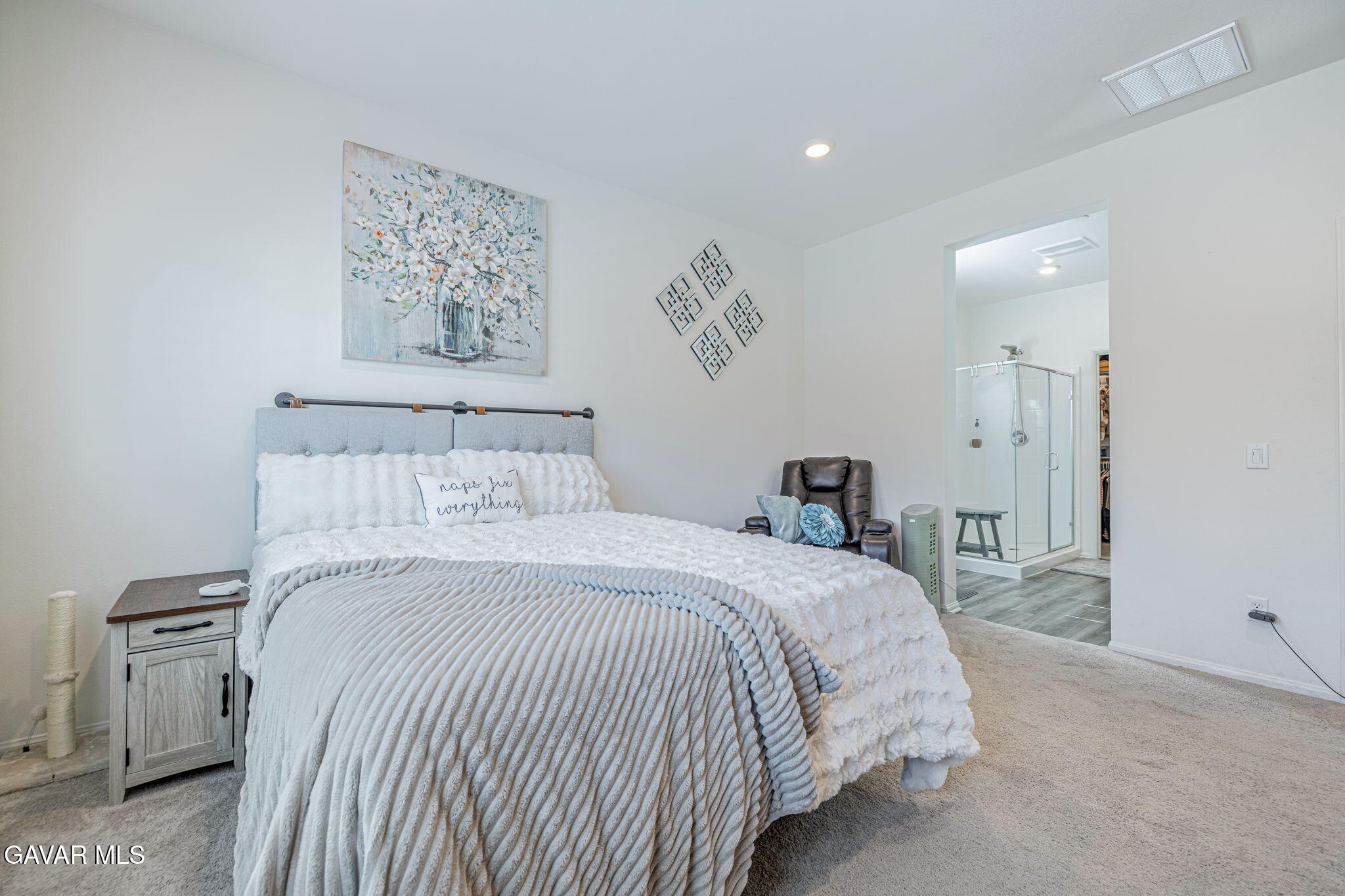 44302 Marbella Street Lancaster, CA 93536 - Photo 37 of 38 a bedroom with a bed and a painting on the wall