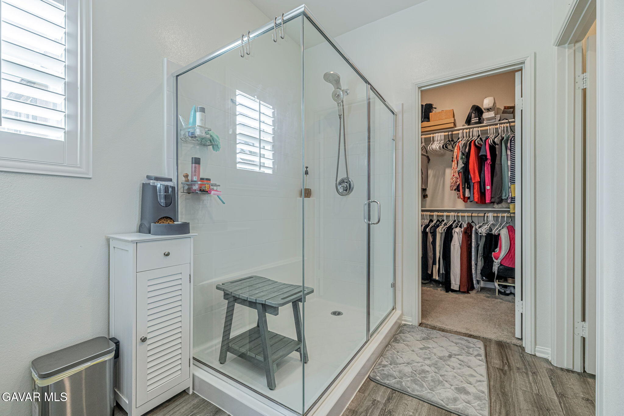 44302 Marbella Street Lancaster, CA 93536 - Photo 6 of 38 a view of walk in closet with clothes and shoes