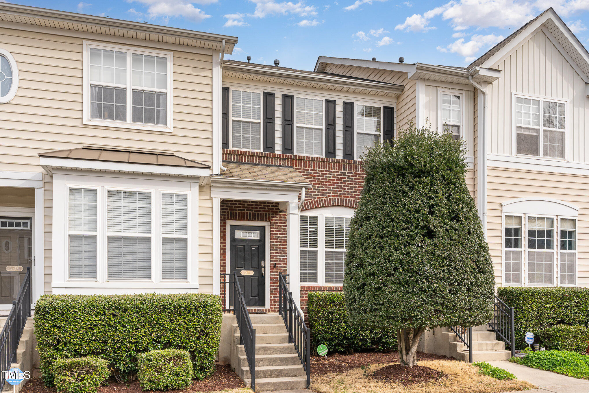 7810 Spungold Street Raleigh, NC 27617 - Photo 1 of 12 a front view of a house with a yard