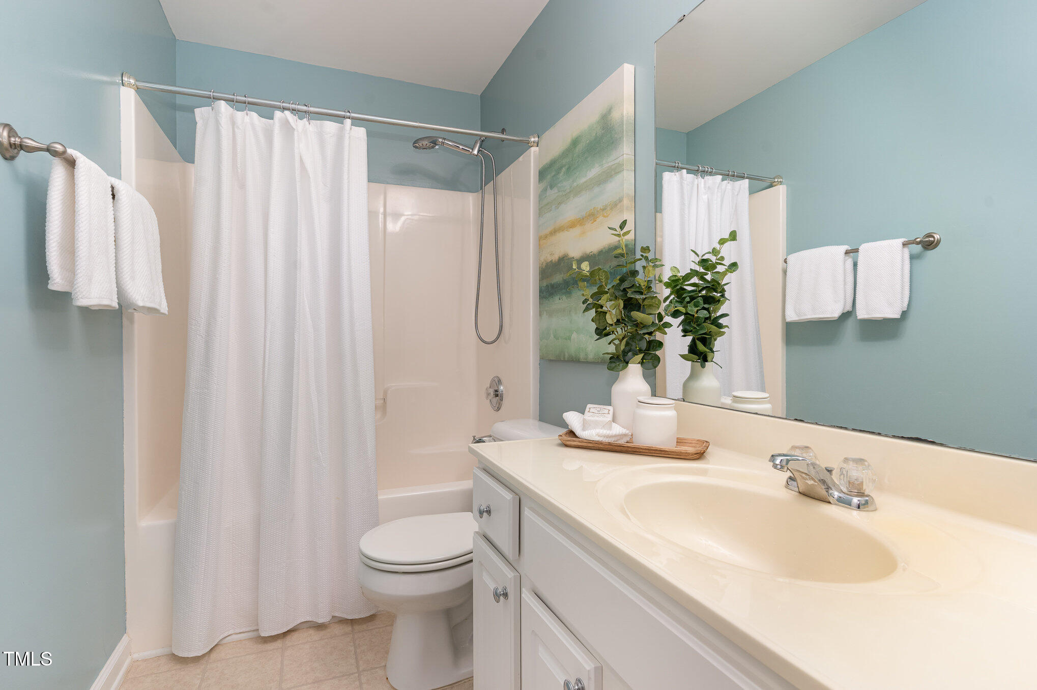 7810 Spungold Street Raleigh, NC 27617 - Photo 11 of 12 a bathroom with a granite countertop sink toilet and shower