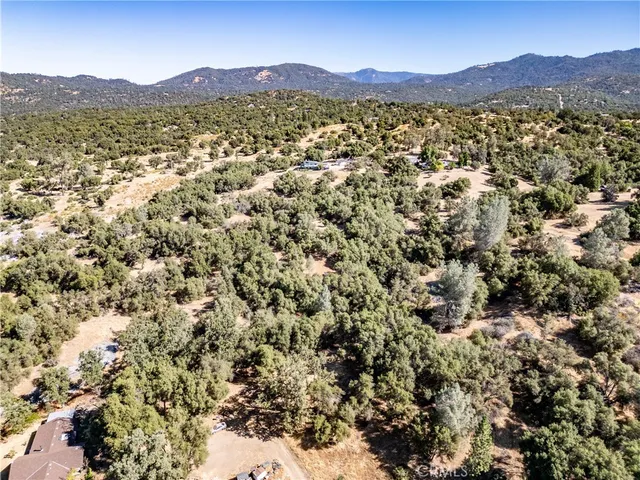 view of a mountain range in a cloudy sky