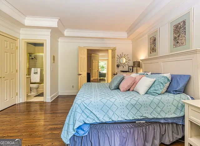 a kitchen with kitchen island granite countertop wooden floor and stainless steel appliances