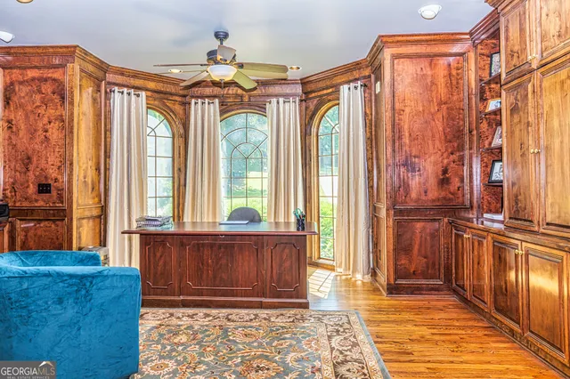 a kitchen with stainless steel appliances granite countertop a stove and a large window