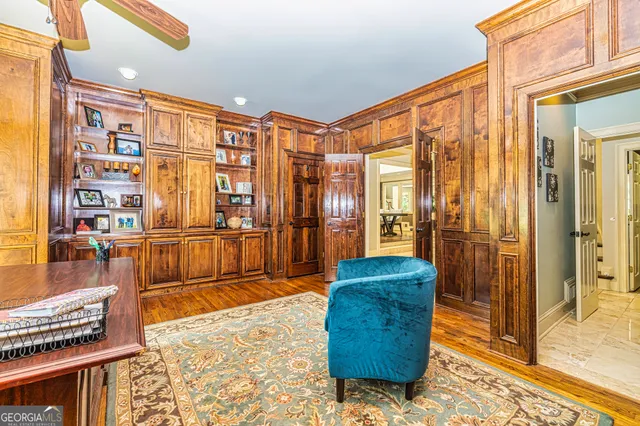a living room with furniture and a dining table