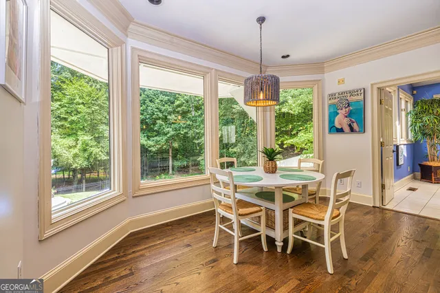 a view of balcony with wooden floor and outdoor seating
