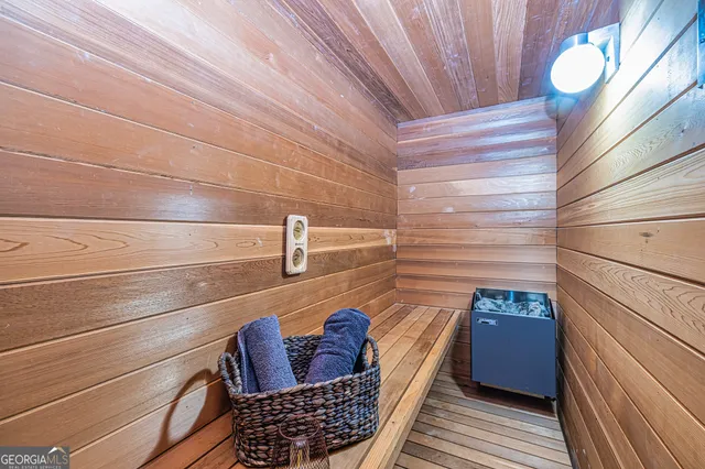 a view of walk in closet with clothes