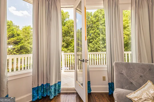 a room with furniture and wooden floor