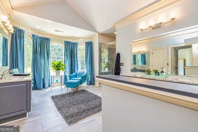 a picture of a bathroom with a sink and a mirror