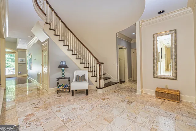 a bedroom with a large bed and a large window