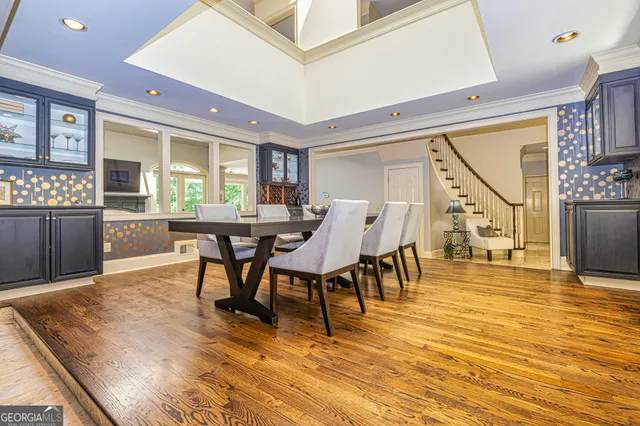 a living room with fireplace furniture and a large window