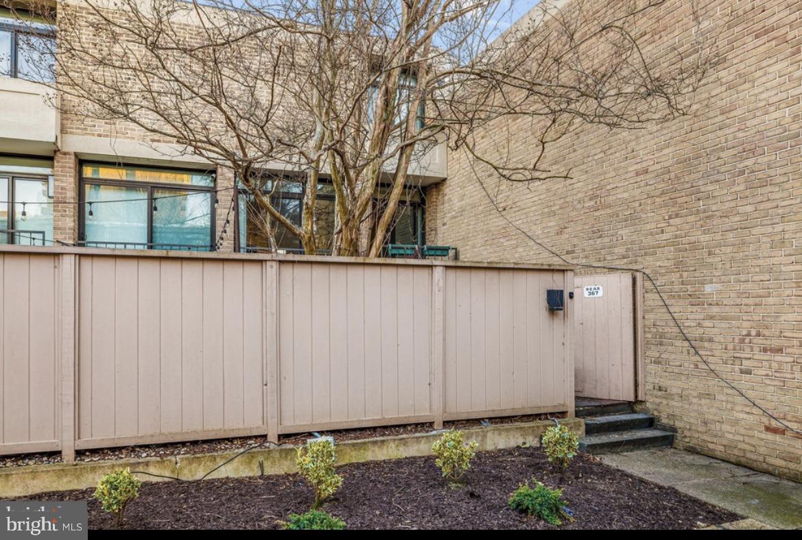 387 N Street Southwest Washington, DC 20024 - Photo 4 of 22 Charming entryway with lush greenery.