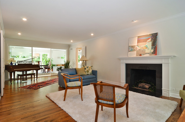 1141 Hibbard Road Wilmette, IL 60091 - Photo 2 of 20 a living room with furniture and a fireplace