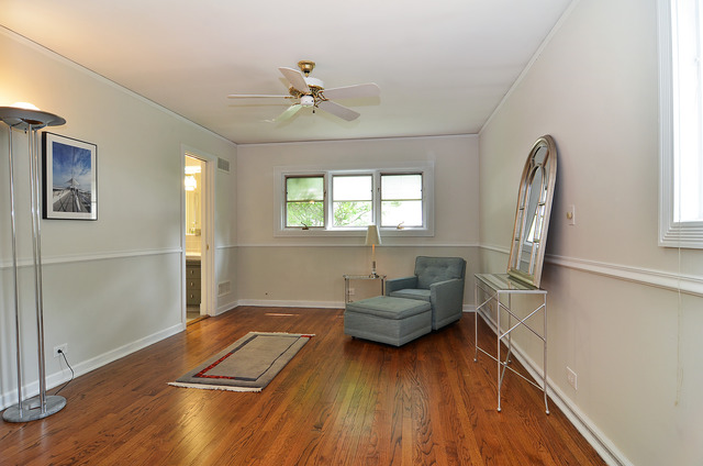 1141 Hibbard Road Wilmette, IL 60091 - Photo 12 of 20 a living room with furniture and a wooden floor