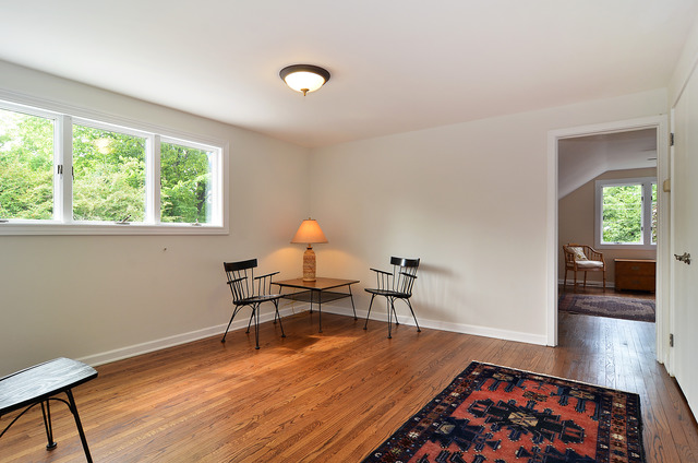 1141 Hibbard Road Wilmette, IL 60091 - Photo 14 of 20 a living room with furniture and a wooden floor