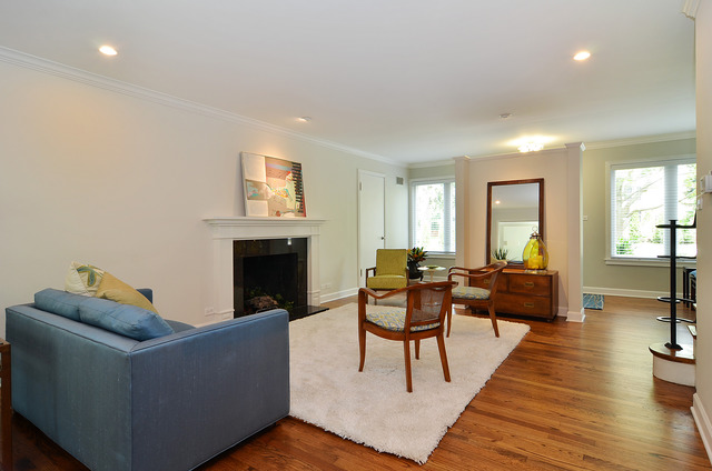 1141 Hibbard Road Wilmette, IL 60091 - Photo 16 of 20 a living room with furniture and a fireplace