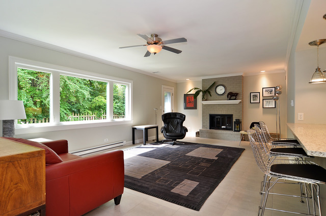 1141 Hibbard Road Wilmette, IL 60091 - Photo 4 of 20 a living room with furniture large window and a fireplace