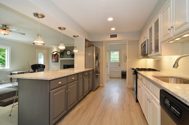 1141 Hibbard Road Wilmette, IL 60091 - Photo 5 of 20 a large kitchen with a lot of counter space and wooden floor