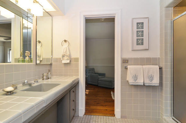 1141 Hibbard Road Wilmette, IL 60091 - Photo 7 of 20 a en suite bathroom with a sink and a mirror