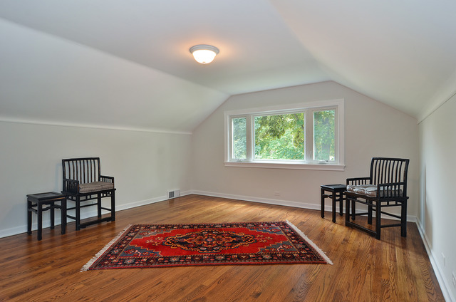1141 Hibbard Road Wilmette, IL 60091 - Photo 9 of 20 a bed sitting in a bedroom next to a window