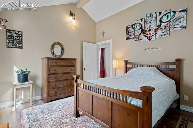 a bedroom with furniture and a window