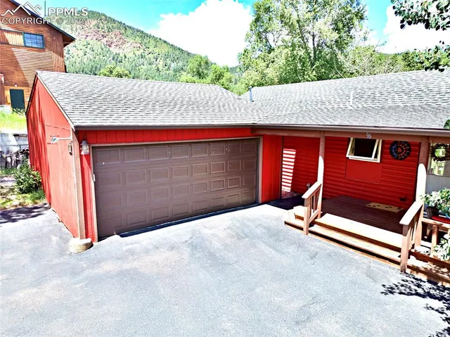 a backyard of a house with basket ball court