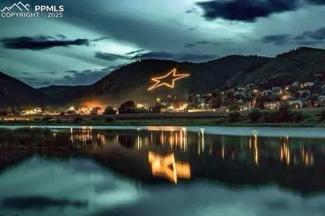 an aerial view of house with yard swimming pool and outdoor seating