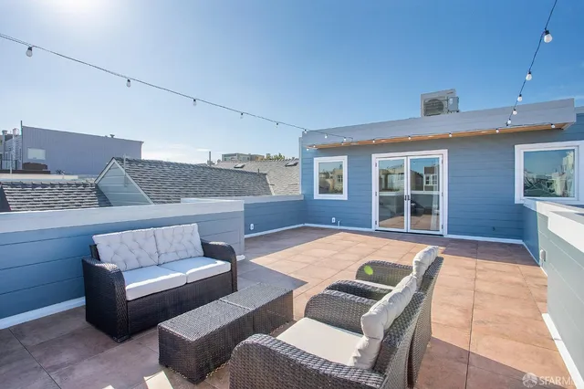 a living room with furniture and a window