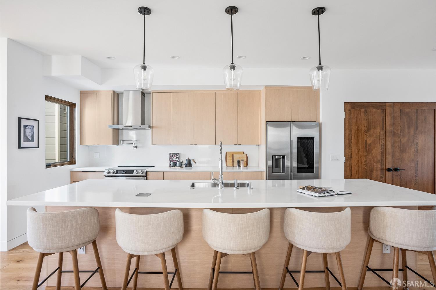 538 22nd Avenue San Francisco, CA 94121 - Photo 6 of 23 a kitchen with stainless steel appliances granite countertop a sink a stove a dining table and chairs