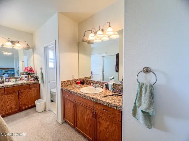 a bathroom with a sink a vanity and mirror