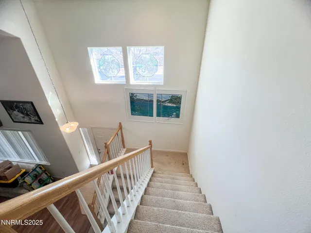 a view of a hallway with windows