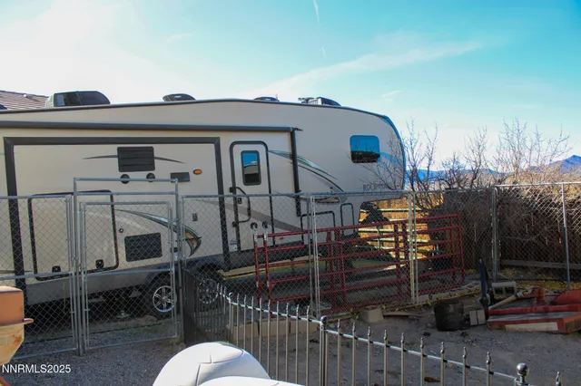 a view of a house with wooden deck front door
