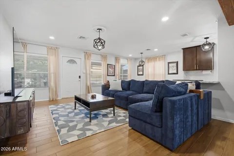 a living room with furniture and a flat screen tv