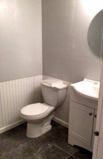 36 General Lawrence Road South Yarmouth, MA 02664 - Photo 8 of 14 a white toilet sitting next to a white sink and vanity